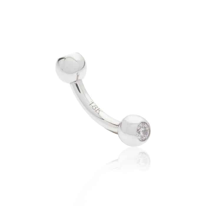 Piercing génital en or blanc barre courbe avec pic et boule en or